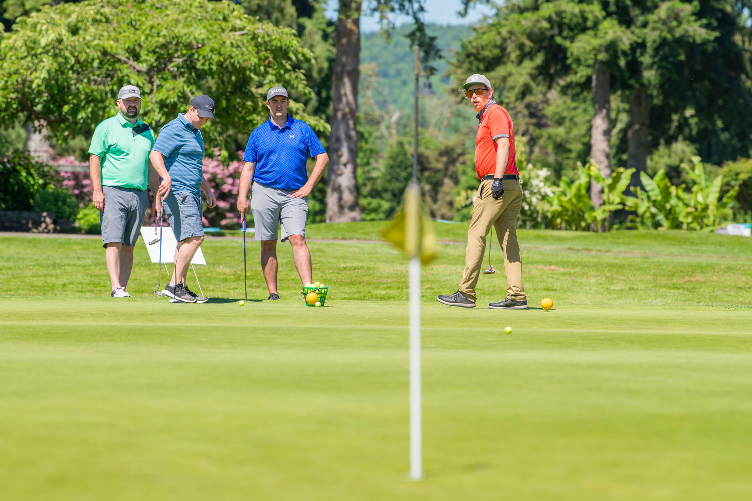 Gabriel Michael watches a put during a charity golf tournament raising money for the Hope Alliance Friday in Chehalis.